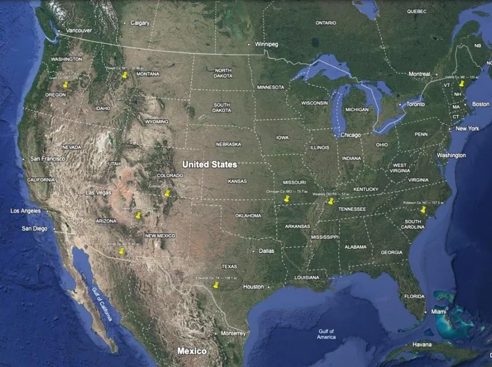 The lower 48 with ten yellow pins, one per property on a shortlist, each labelled with its county, state and acreage.